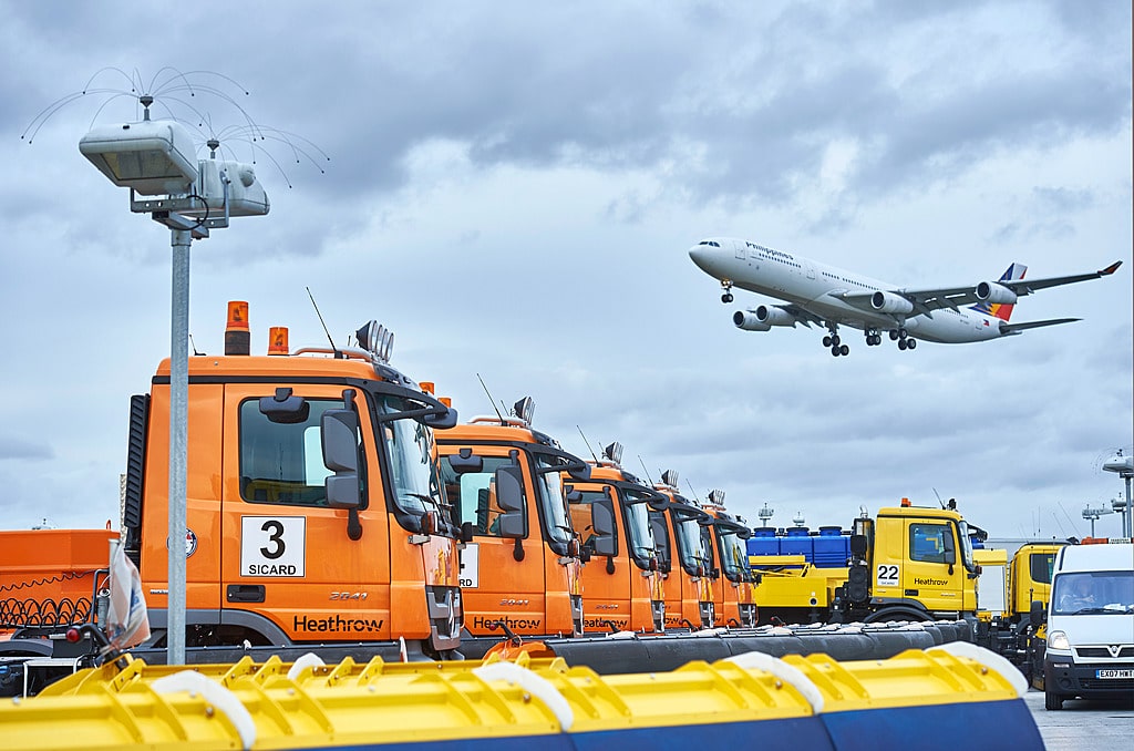 photo of airplane and trucks